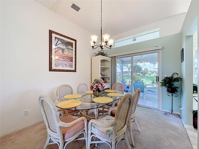 27141 Racquet Cir, Leesburg, FL 34748 - dining room with light carpet and a chandelier