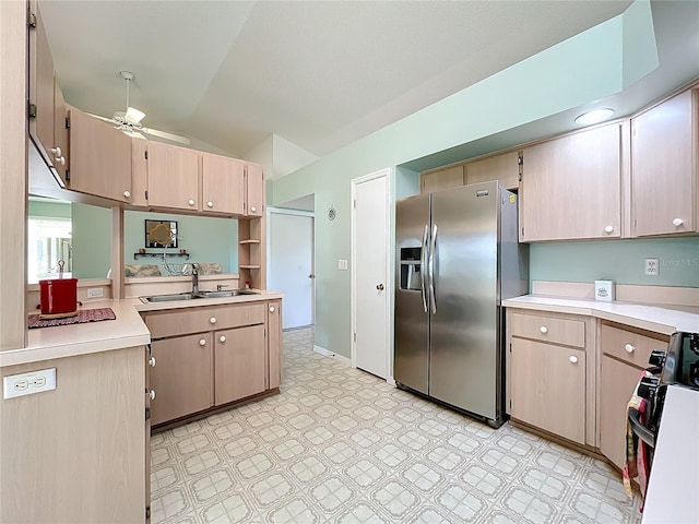 27141 Racquet Cir, Leesburg, FL 34748 - kitchen featuring stainless steel refrigerator with ice dispenser, stove, lofted ceiling, a ceiling fan, and light countertops