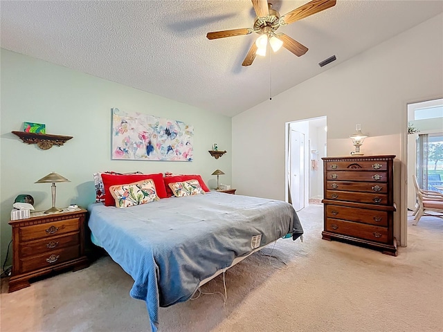 27141 Racquet Cir, Leesburg, FL 34748 - carpeted bedroom with vaulted ceiling, a ceiling fan, ensuite bath, and a textured ceiling
