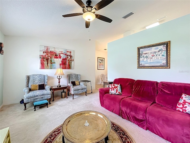 27141 Racquet Cir, Leesburg, FL 34748 - carpeted living area with a ceiling fan and a textured ceiling