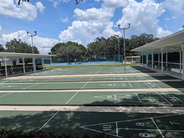 27141 Racquet Cir, Leesburg, FL 34748 - view of property's community with a tennis court and shuffleboard