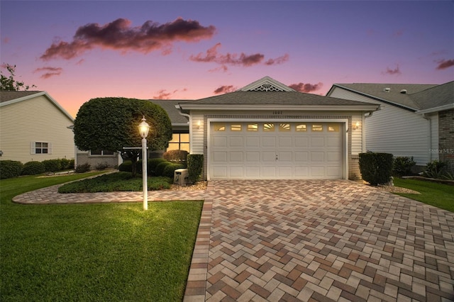 1007 Diego Ct, The Villages, FL 32159 - ranch-style home featuring decorative driveway, a front lawn, and an attached garage