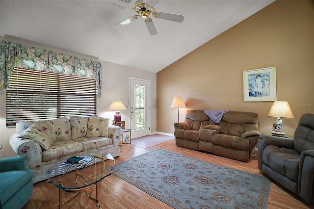1007 Diego Ct, The Villages, FL 32159 - living area featuring ceiling fan, wood finished floors, and high vaulted ceiling