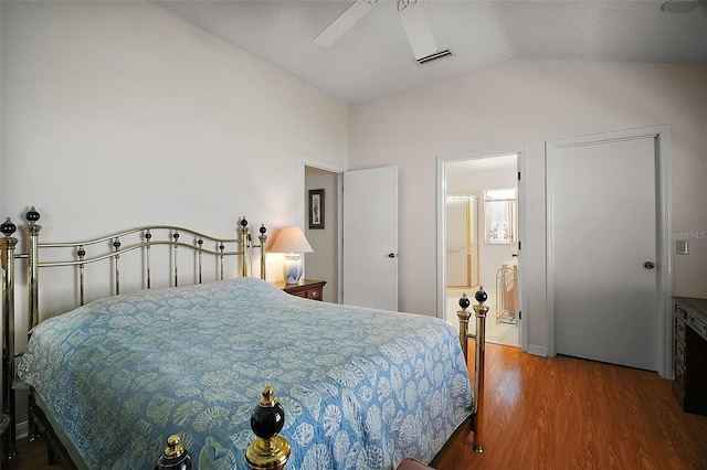 1007 Diego Ct, The Villages, FL 32159 - bedroom with lofted ceiling, wood finished floors, ceiling fan, and connected bathroom