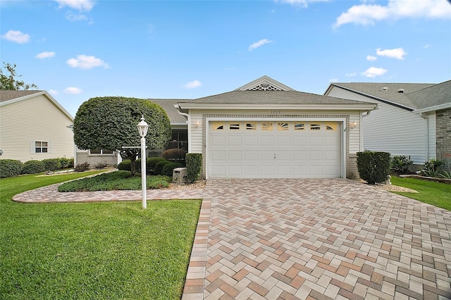 1007 Diego Ct, The Villages, FL 32159 - single story home with decorative driveway, a front yard, a garage, and roof with shingles