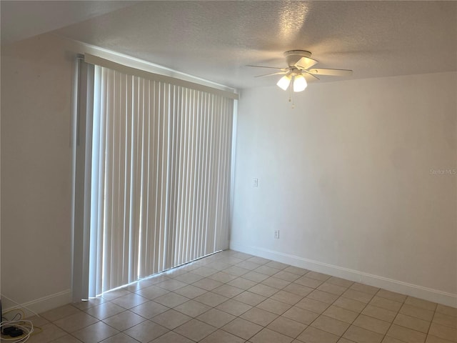 624 Australian Way, Davenport, FL 33897 - unfurnished room featuring a textured ceiling, a ceiling fan, and light tile patterned flooring