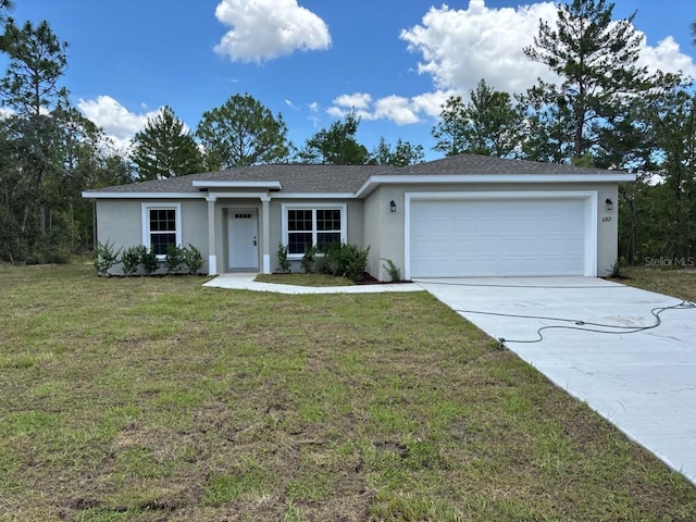 6769 N Waterman Dr, Dunnellon, FL 34433 - ranch-style house with stucco siding, an attached garage, concrete driveway, and a front yard