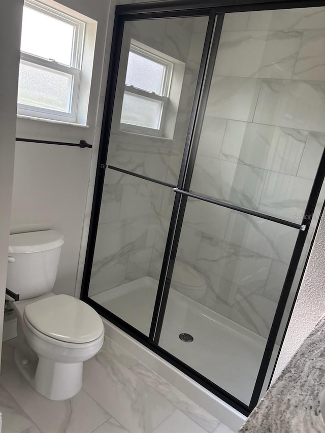 6769 N Waterman Dr, Dunnellon, FL 34433 - full bathroom featuring healthy amount of natural light, a shower stall, and marble finish flooring