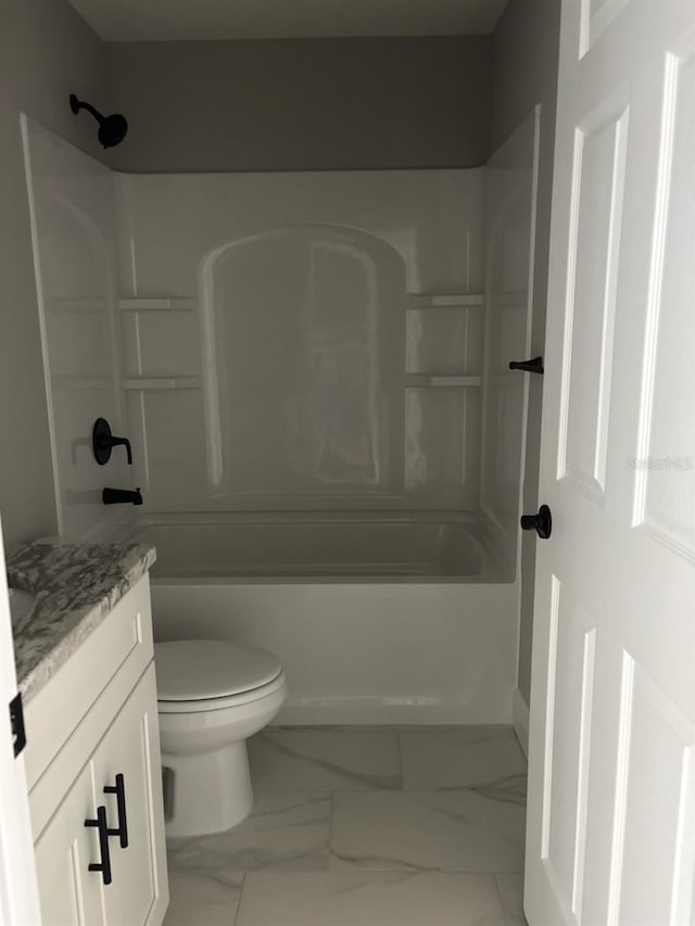 6769 N Waterman Dr, Dunnellon, FL 34433 - full bathroom featuring vanity, marble look tile flooring, and shower / tub combination
