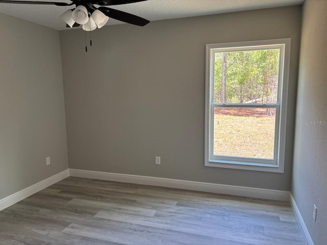 6769 N Waterman Dr, Dunnellon, FL 34433 - spare room featuring wood finished floors and a ceiling fan