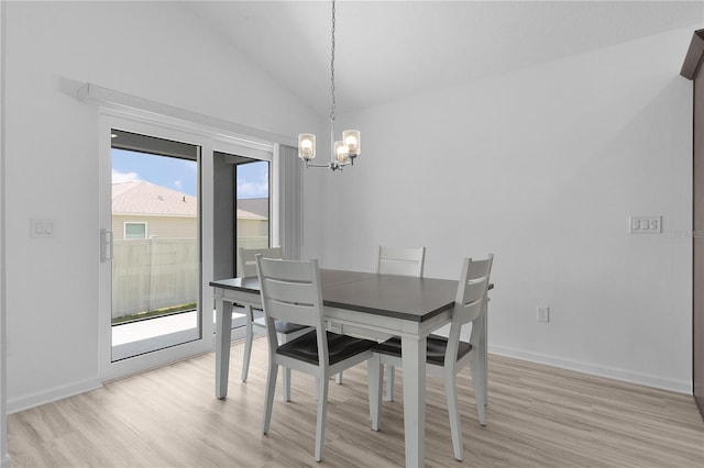 6949 Minchew Cir, The Villages, FL 34762 - dining area featuring a chandelier, light wood finished floors, and lofted ceiling