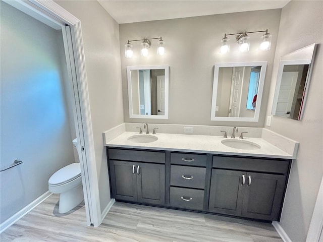 6949 Minchew Cir, The Villages, FL 34762 - bathroom with double vanity and wood finished floors