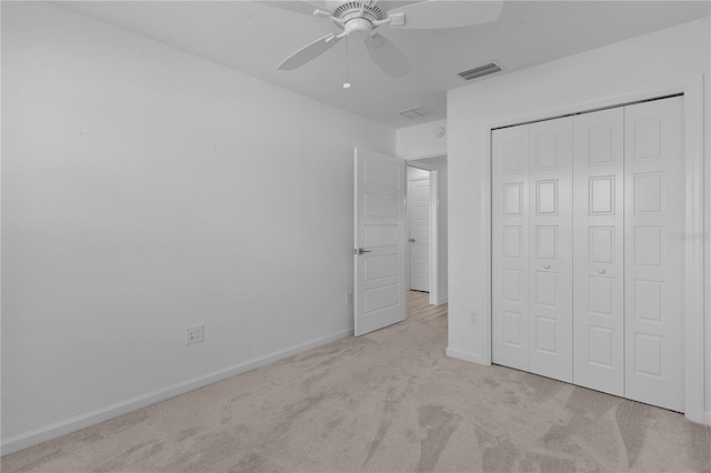 6949 Minchew Cir, The Villages, FL 34762 - unfurnished bedroom with carpet, a closet, and ceiling fan