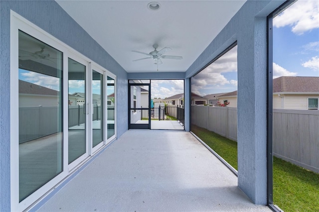 6949 Minchew Cir, The Villages, FL 34762 - unfurnished sunroom featuring a ceiling fan