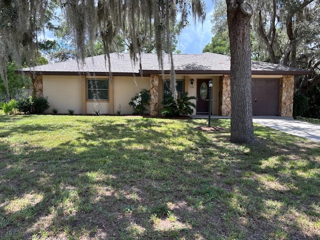 7186 N Whippoorwill Ter, Hernando, FL 34442 - single story home featuring an attached garage, stucco siding, stone siding, concrete driveway, and a front lawn