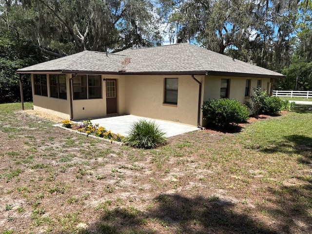 7186 N Whippoorwill Ter, Hernando, FL 34442 - rear view of property with stucco siding and a patio area