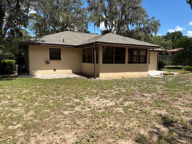 7186 N Whippoorwill Ter, Hernando, FL 34442 - rear view of house featuring stucco siding, a patio, and roof with shingles