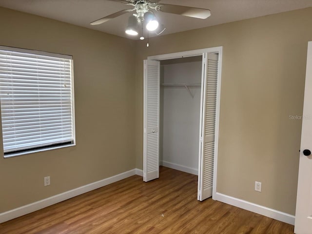 7186 N Whippoorwill Ter, Hernando, FL 34442 - unfurnished bedroom with wood finished floors, a closet, and a ceiling fan