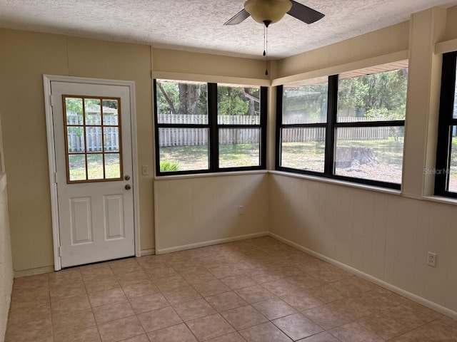 7186 N Whippoorwill Ter, Hernando, FL 34442 - doorway with a textured ceiling, ceiling fan, and light tile patterned floors