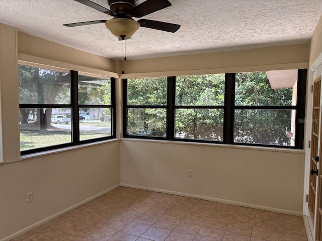 7186 N Whippoorwill Ter, Hernando, FL 34442 - empty room featuring a textured ceiling, a ceiling fan, and tile patterned floors