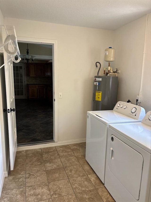 7186 N Whippoorwill Ter, Hernando, FL 34442 - laundry area with electric water heater, washer and clothes dryer, and a chandelier
