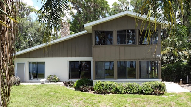 11401 Cypress Dr, Clermont, FL 34711 - rear view of property featuring a yard and a chimney