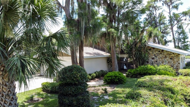 11401 Cypress Dr, Clermont, FL 34711 - view of side of home with stone siding and stucco siding