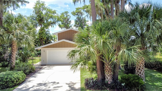 11401 Cypress Dr, Clermont, FL 34711 - view of front of house featuring concrete driveway and an attached garage