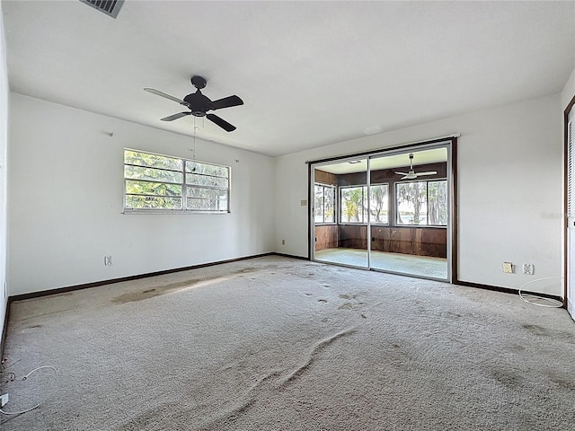 11401 Cypress Dr, Clermont, FL 34711 - carpeted empty room with healthy amount of natural light and ceiling fan