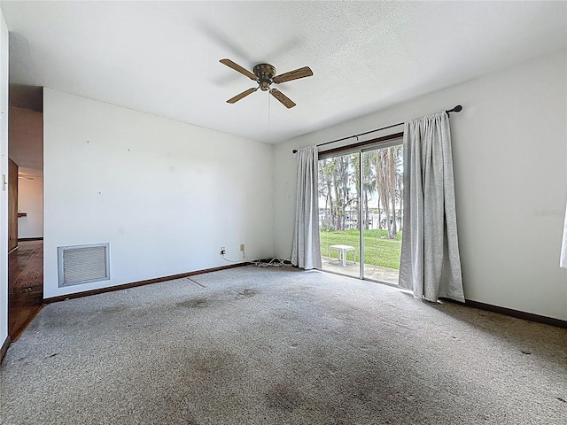 11401 Cypress Dr, Clermont, FL 34711 - carpeted empty room with a ceiling fan and baseboards