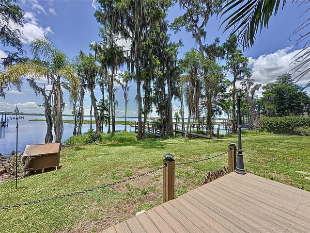 11401 Cypress Dr, Clermont, FL 34711 - wooden terrace featuring a water view and a lawn