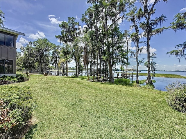 11401 Cypress Dr, Clermont, FL 34711 - view of green lawn featuring a water view