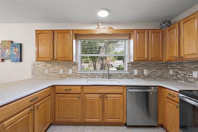 1002 Amarillo Pl, The Villages, FL 32159 - kitchen with stainless steel dishwasher, a textured ceiling, range with electric stovetop, brown cabinetry, and decorative backsplash