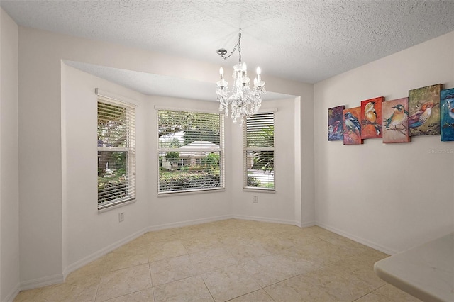 1002 Amarillo Pl, The Villages, FL 32159 - unfurnished dining area featuring a chandelier, tile patterned flooring, and a textured ceiling