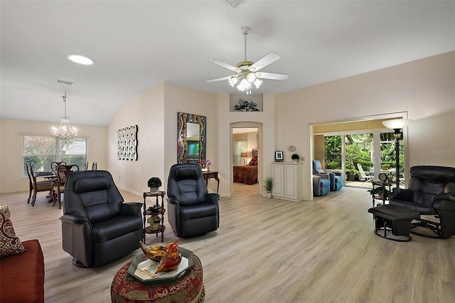 1002 Amarillo Pl, The Villages, FL 32159 - living room featuring a chandelier, light wood-type flooring, healthy amount of natural light, and a ceiling fan