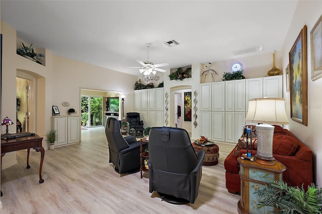 1002 Amarillo Pl, The Villages, FL 32159 - living room featuring arched walkways, light wood finished floors, and ceiling fan