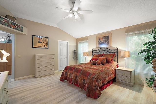 1002 Amarillo Pl, The Villages, FL 32159 - bedroom with light wood-style flooring, lofted ceiling, and ceiling fan