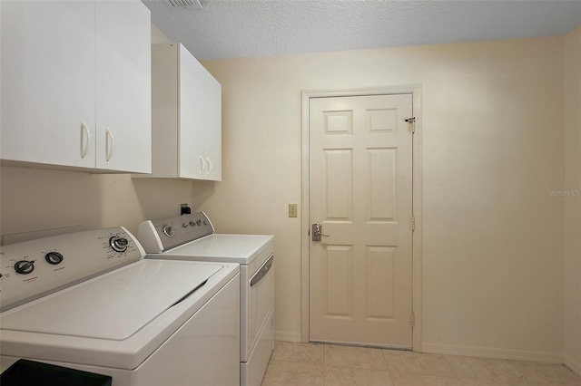 1002 Amarillo Pl, The Villages, FL 32159 - washroom featuring cabinet space, washer and dryer, and light tile patterned flooring