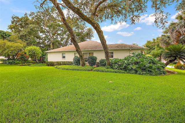 1002 Amarillo Pl, The Villages, FL 32159 - view of home's exterior with a lawn and stucco siding