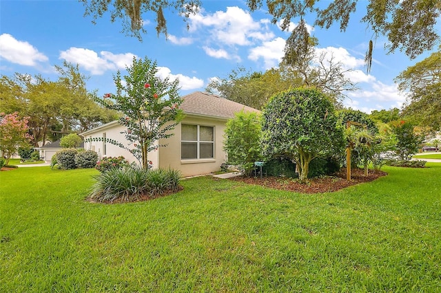 1002 Amarillo Pl, The Villages, FL 32159 - view of property exterior with a lawn and stucco siding