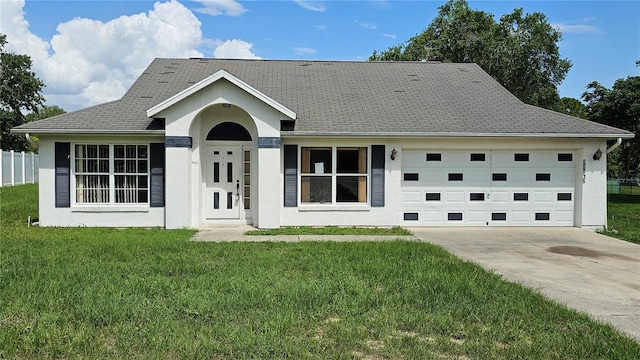12512 Draw Dr, Grand Island, FL 32735 - single story home featuring concrete driveway, an attached garage, and stucco siding