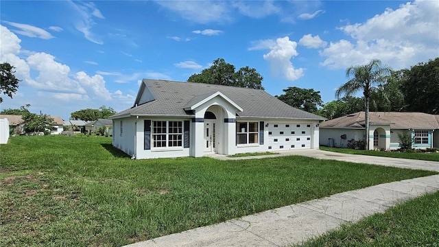 12512 Draw Dr, Grand Island, FL 32735 - single story home with concrete driveway, a front yard, a garage, and stucco siding