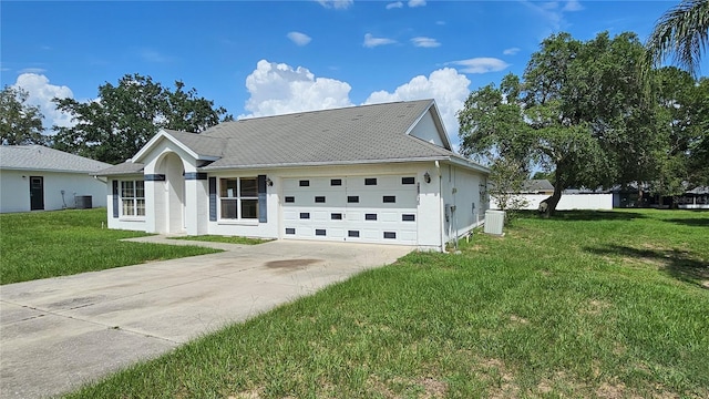 12512 Draw Dr, Grand Island, FL 32735 - single story home with driveway, an attached garage, a front yard, and stucco siding
