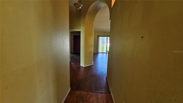 12512 Draw Dr, Grand Island, FL 32735 - corridor featuring arched walkways and wood finished floors