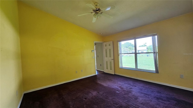 12512 Draw Dr, Grand Island, FL 32735 - unfurnished room with lofted ceiling, dark carpet, and ceiling fan