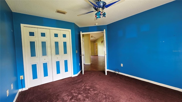 12512 Draw Dr, Grand Island, FL 32735 - unfurnished bedroom with carpet floors, a closet, a ceiling fan, and a textured ceiling