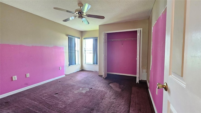 12512 Draw Dr, Grand Island, FL 32735 - unfurnished bedroom with carpet flooring, a closet, a ceiling fan, and a textured ceiling