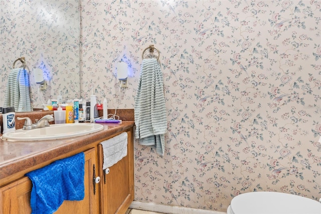 3401 Sunrise Villas Ct S, Tampa, FL 33614 - half bathroom with wallpapered walls and vanity