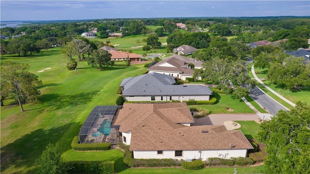 aerial perspective of suburban area with a golf club and a tree filled landscape