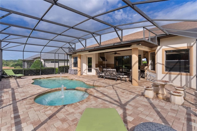 view of swimming pool featuring a ceiling fan, a patio area, and a pool with connected hot tub